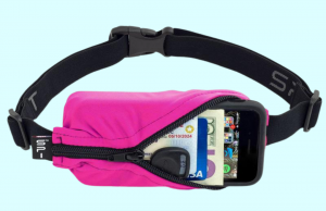 Bright pink running belt holding a cell phone, case, credit card, ID, and car key